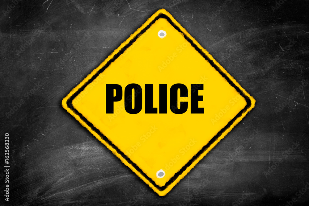 police written on caution sign police written on caution sign