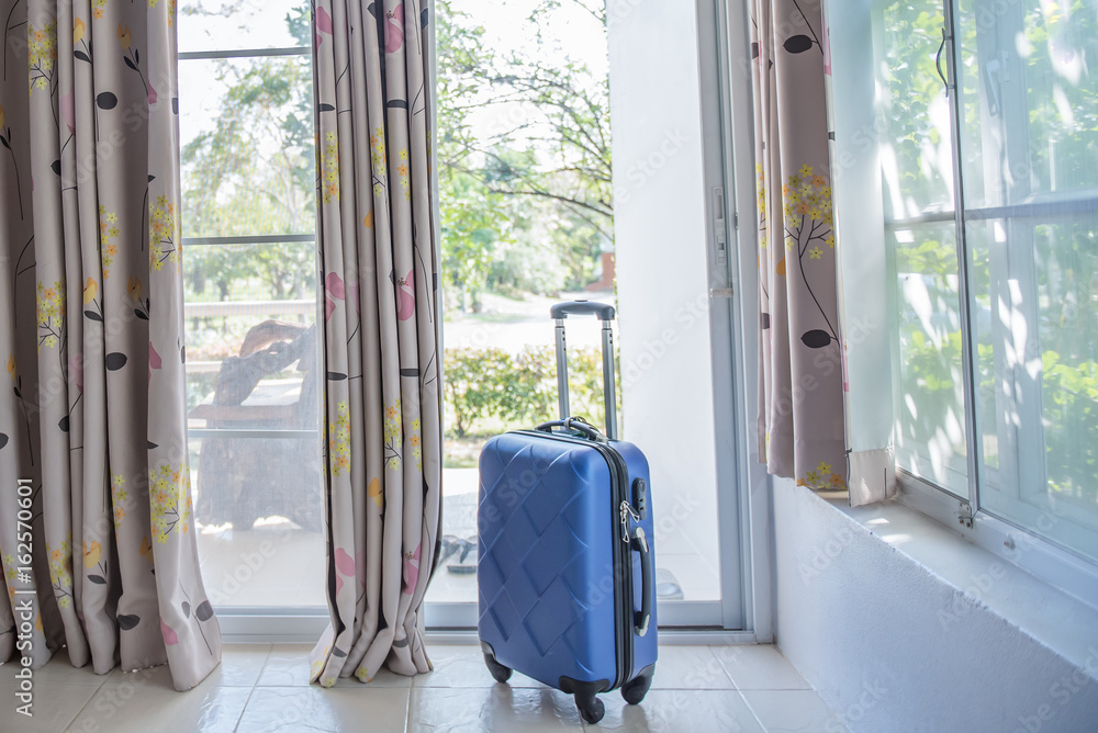 Time to Relax, suitcase standing on the floor in the room in front of curtain ant door, travel lifestyle concept. Time to Relax, suitcase standing on the floor in the room in front of curtain ant door, travel lifestyle concept.
