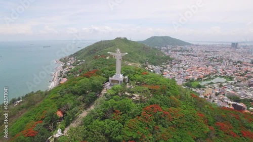 Aerial of Jesus Christ statue along Vung Tau beach coast