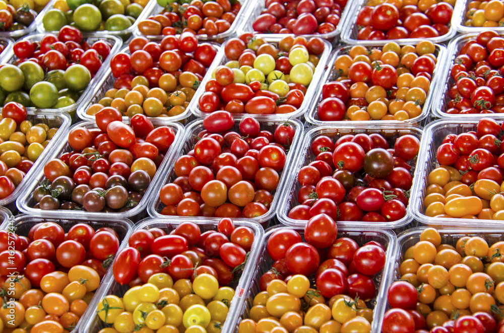 Close up of fresh grape tomatoes at the farmers' market. Close up of fresh grape tomatoes at the farmers' market.