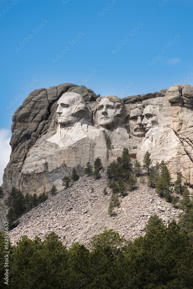 Vertical Side view of Mount Rushmore with sunlight Vertical Side view of Mount Rushmore with sunlight