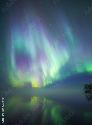 Aurora borealis reflection on Lake, Lapland, Finland 