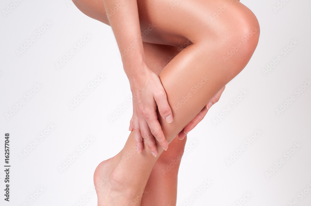 Woman legs with smooth skin after depilation.