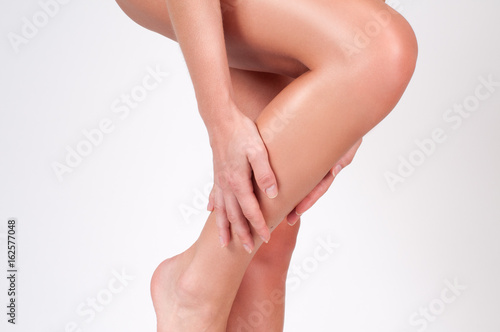 Woman legs with smooth skin after depilation.