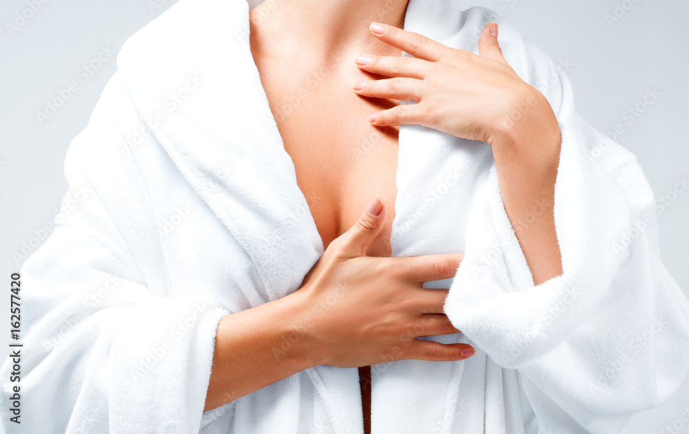 Closeup beautiful woman after bath in white bathrobe Closeup beautiful woman after bath in white bathrobe