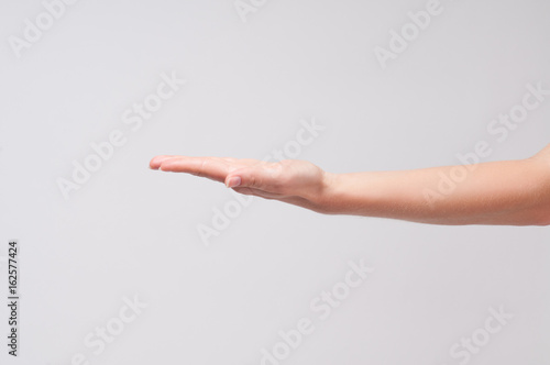 Female hand. Closeup of a woman's palm on white background