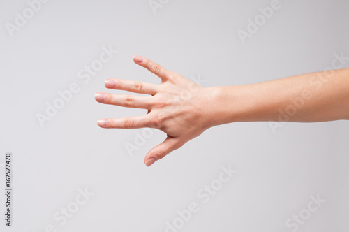 Female hand and five fingers photo