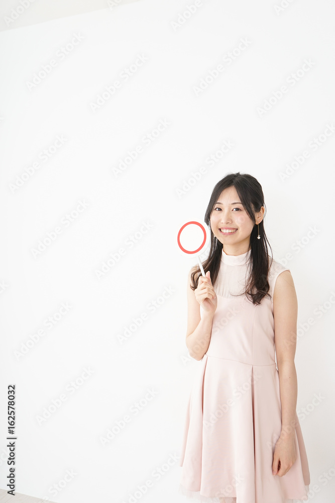 Young woman showing the circle sign Young woman showing the circle sign