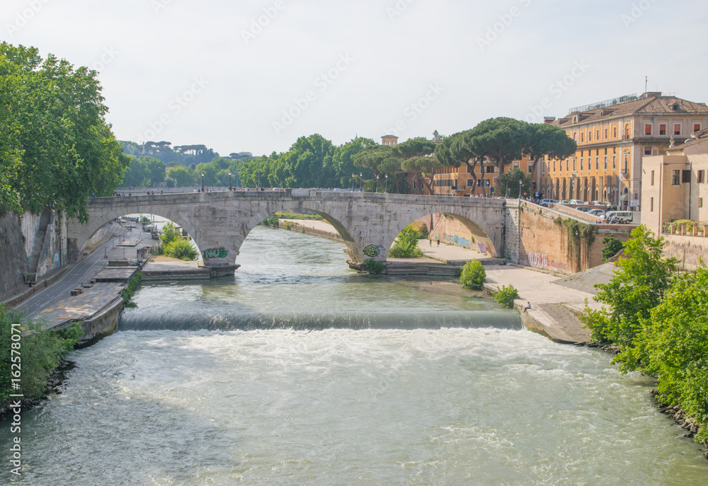 Ponte Fabricio and Isola Tiberina in Rome, Italy. Fabricius Bridge is the oldest Roman bridge in Rome