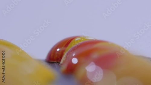 close up of two caramel candies on white background. Salted caramel pieces. Row of caramel candies on white background photo