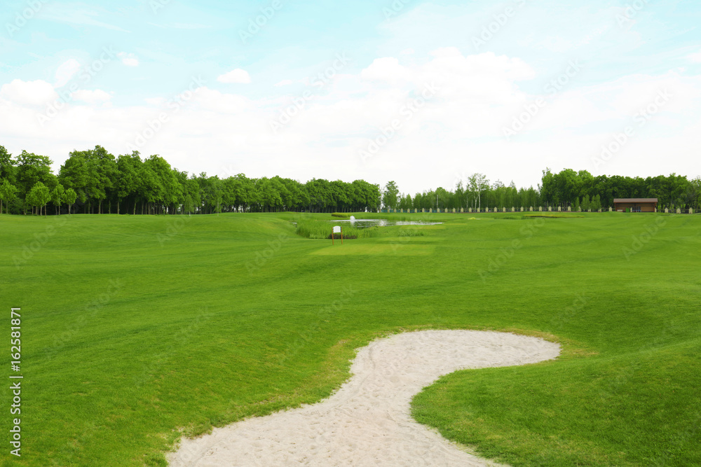 Landscape with big golf course on summer day Landscape with big golf course on summer day