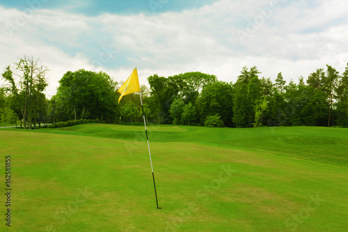 Landscape with big golf course on summer day