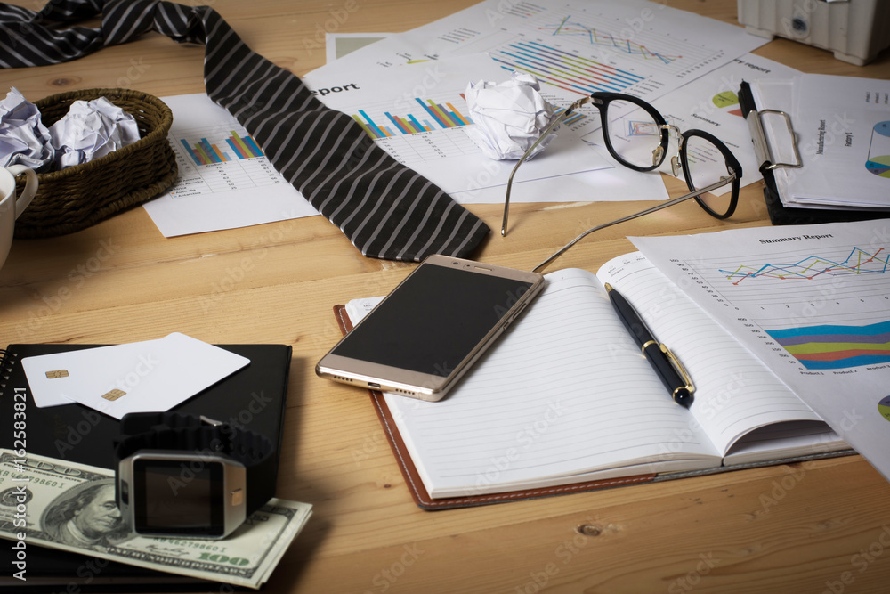 business workplace with paper chart,graph and money. Business finance concept. business workplace with paper chart,graph and money. Business finance concept.