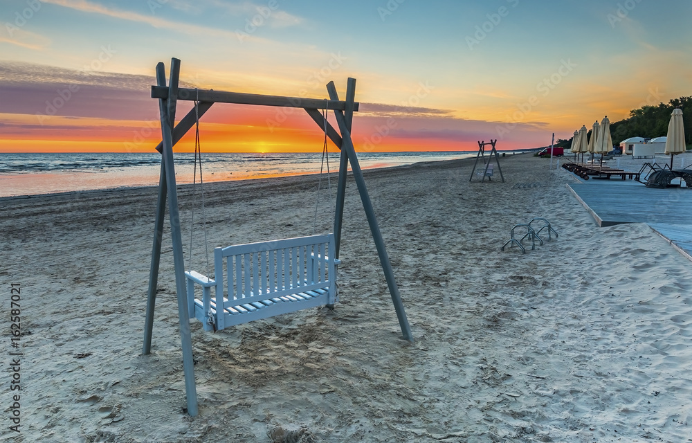 Sunrise at a public beach of Jurmala - famous international resort in Latvia, Europe Sunrise at a public beach of Jurmala - famous international resort in Latvia, Europe