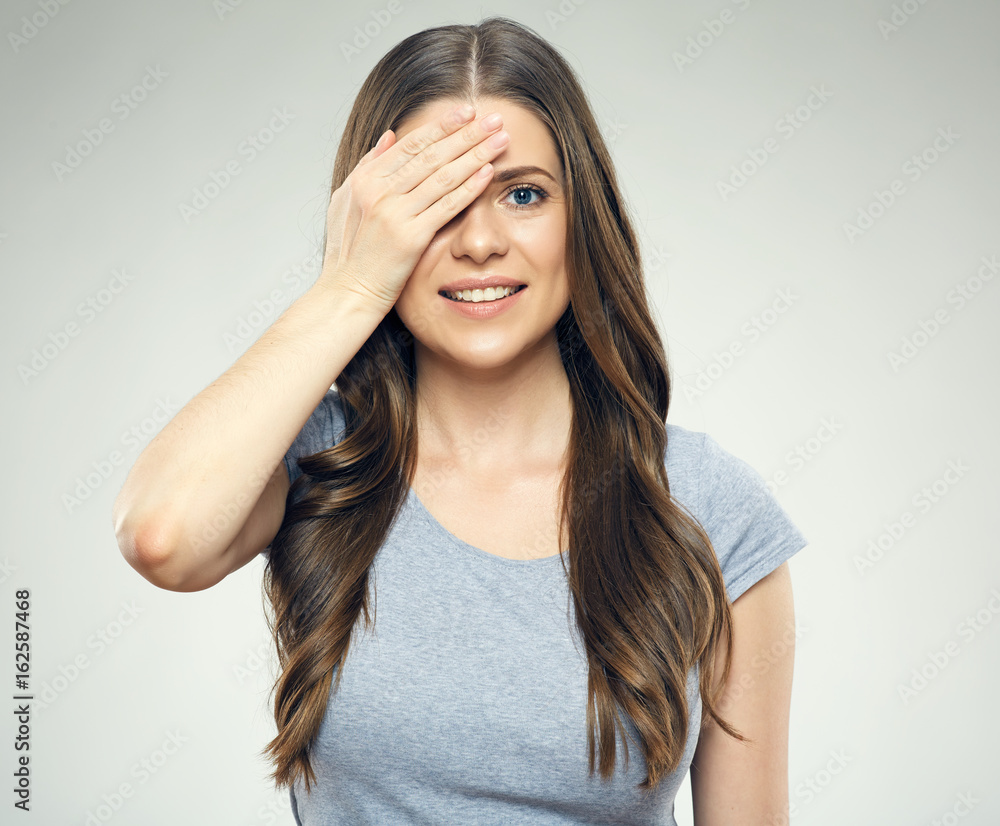 Fototapeta premium Young woman closed eye with hand.