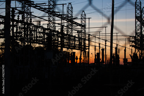 Power lines silhouette on sunset