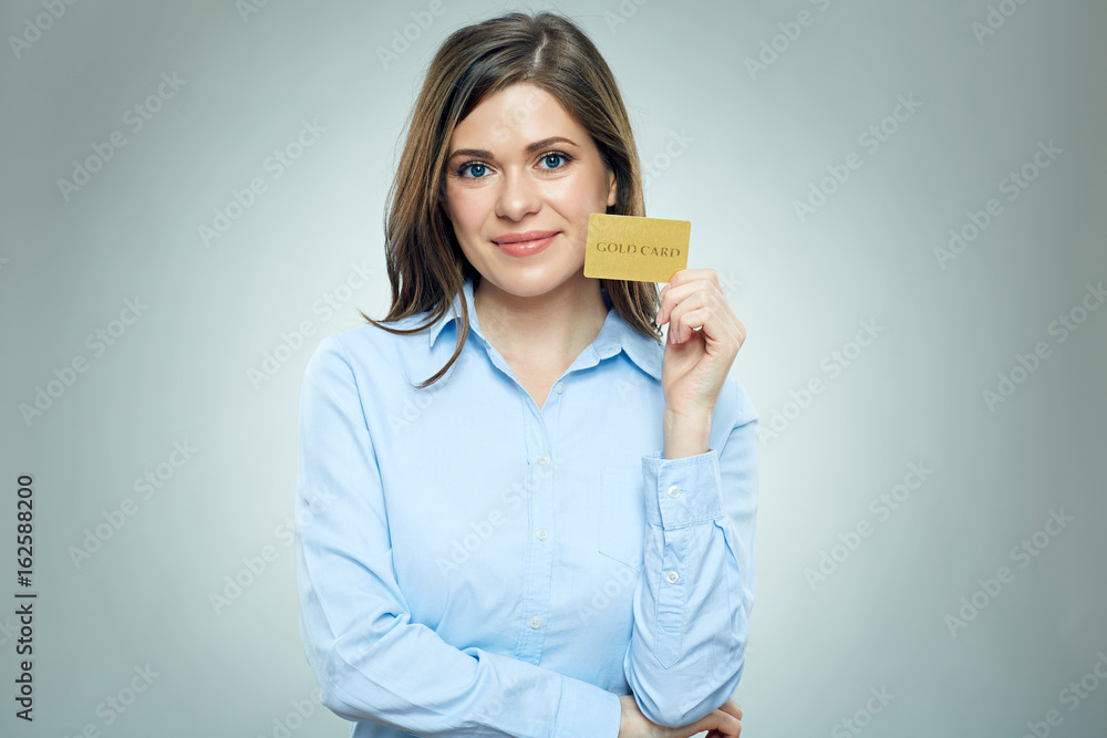 Business woman holding credit card isolated portrait Business woman holding credit card isolated portrait