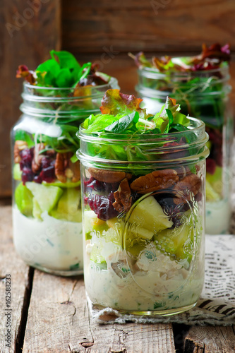 chicken, apple and pecan salad in a jar.style rustic.