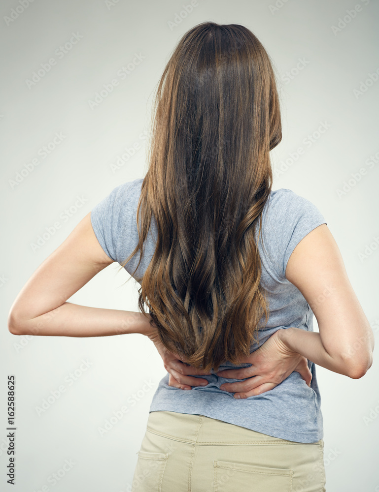 Young woman with back pain Young woman with back pain