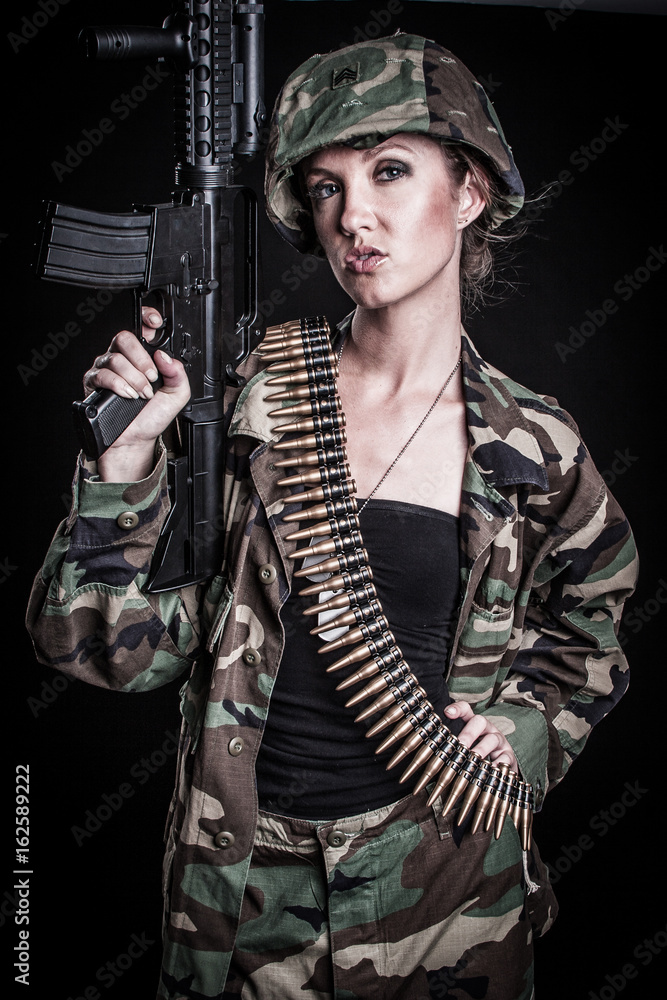 Fototapeta premium Woman Holding Gun