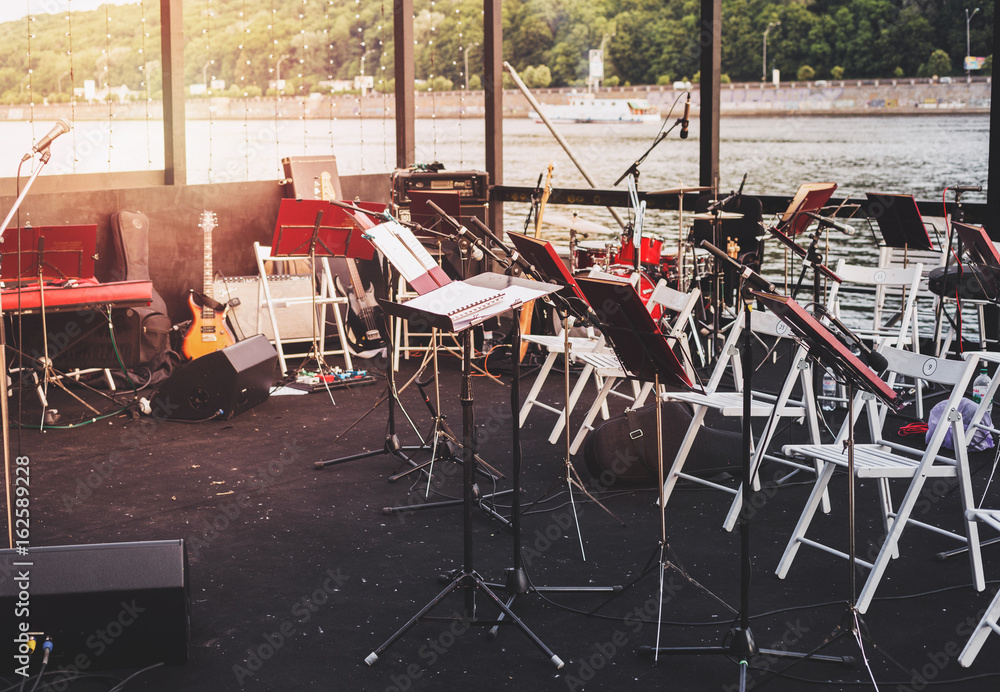 Naklejka premium Different musical instruments on the river bank
