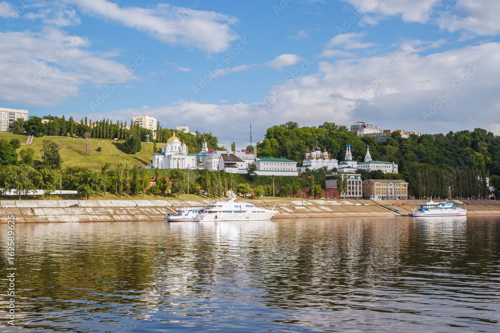 View of the yacht near the pier and the Annunciation Monastery in Nizhny Novgorod View of the yacht near the pier and the Annunciation Monastery in Nizhny Novgorod