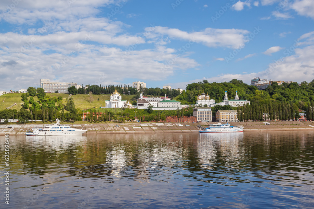 View of the Annunciation Monastery, yacht and omic near the pier in Nizhny Novgorod