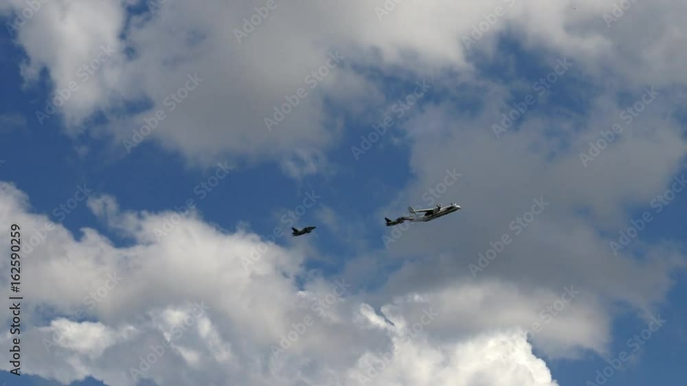Aircraft and fighters fly over houses. The planes fly low. Fighters fly in a row low over the ground. Aircraft and fighters fly over houses. The planes fly low. Fighters fly in a row low over the ground.