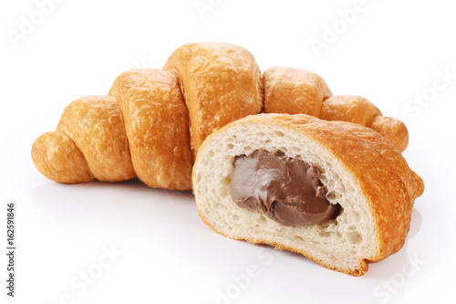 Sliced croissant with chocolate isolated on white background