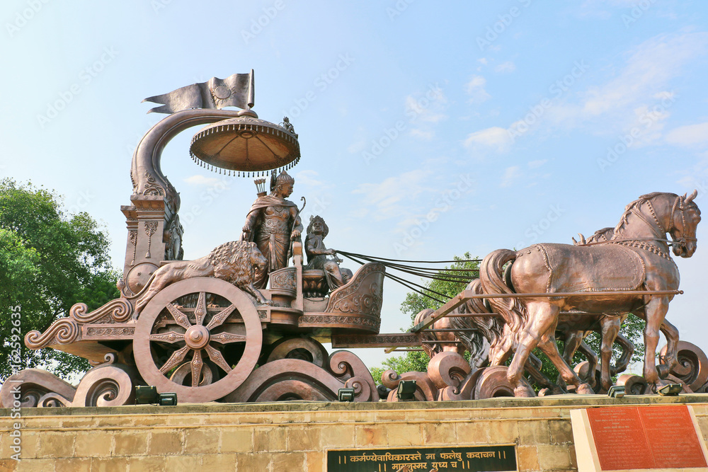 Giant Krishna-Arjuna chariot made of bronze metal, situated at Brahma Sarovar Kurukshetra, Haryana, is a big charm for the pilgrims.
