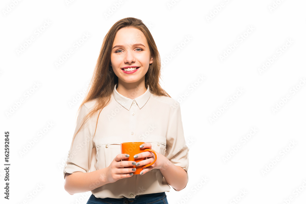 Young smiling girl holding a cup in her hands Young smiling girl holding a cup in her hands