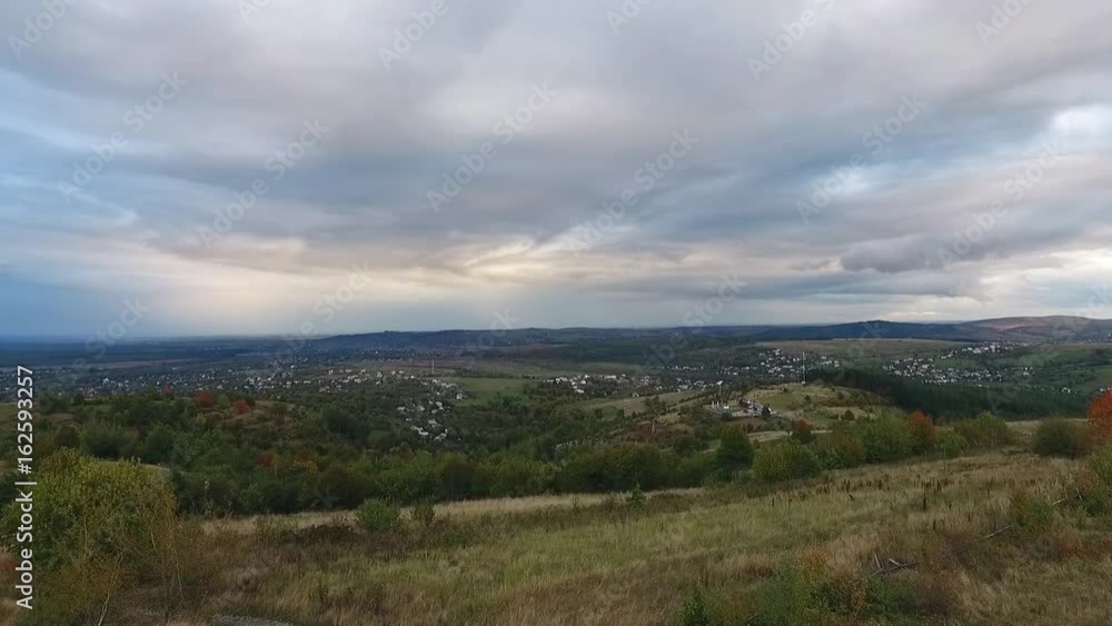 A rural residential area in a beautiful green valley, aerial shot. Country side surrounded by nature. A rural residential area in a beautiful green valley, aerial shot. Country side surrounded by nature.