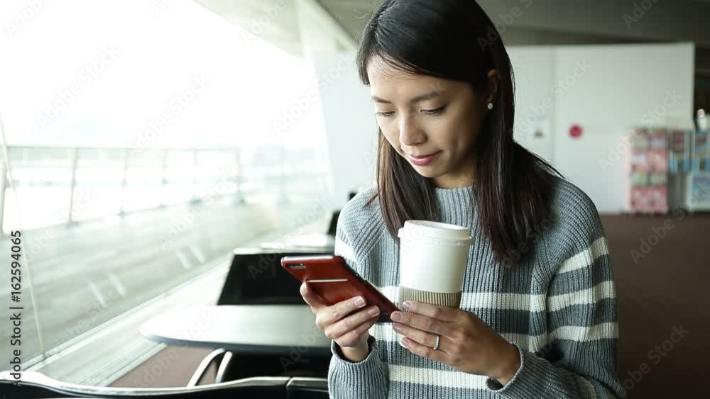 Woman use app on smartphone in cafe drink coffee Woman use app on smartphone in cafe drink coffee