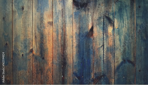 Vintage blue wood texture background with knots and nails