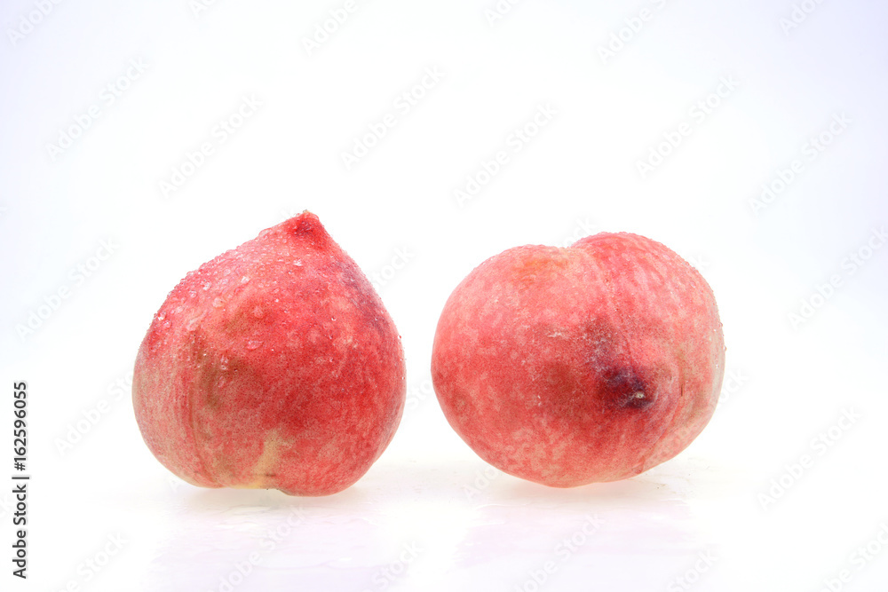 Fresh peaches stand in a white background Fresh peaches stand in a white background