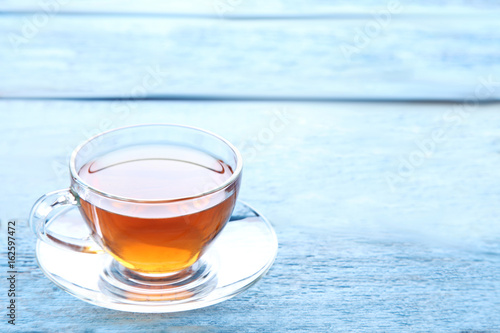 Cup of tea on blue wooden table