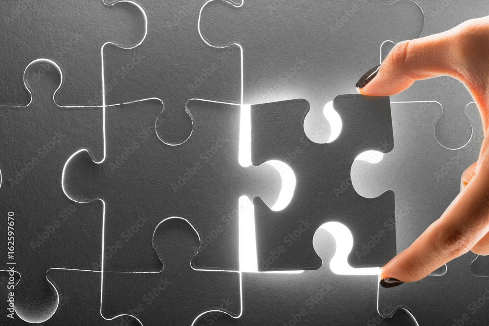 Hands holding puzzle pieces, business concept background
