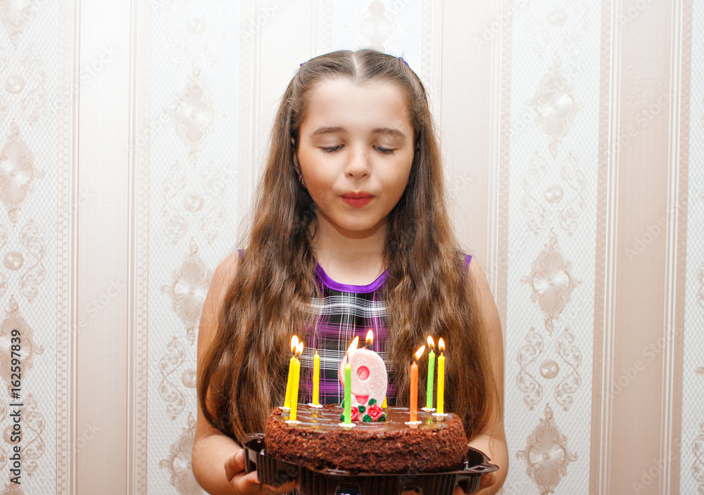 little girl blowing out candles on the cake little girl blowing out candles on the cake