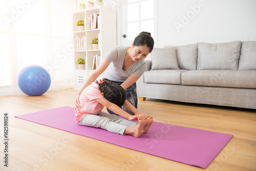 yoga coach teaching the children