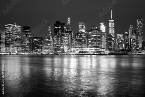 Black and white New York City skyline at night  USA.