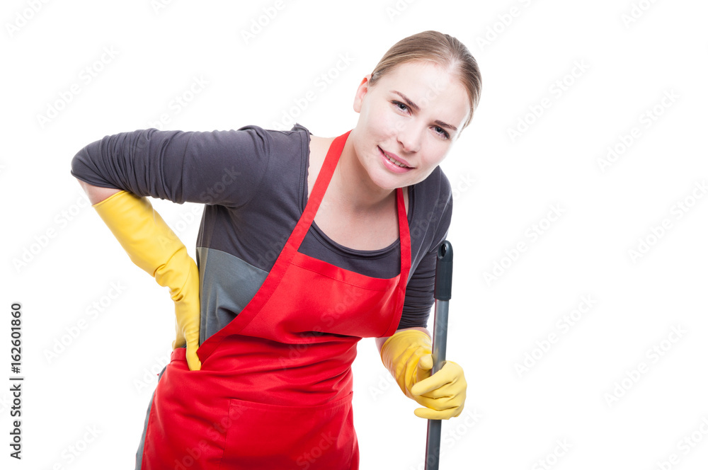 Young housekeeper having backache after cleaning Young housekeeper having backache after cleaning