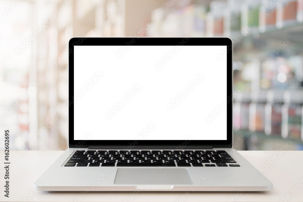 pharmacy store counter table top with blank screen laptop computer pharmacy store counter table top with blank screen laptop computer
