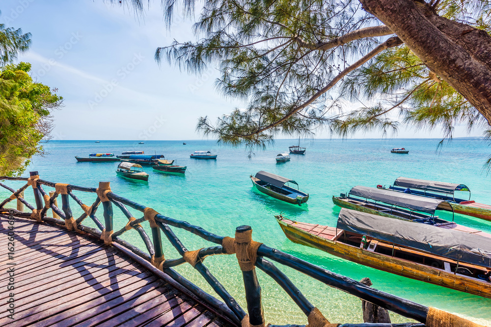 amazing landscape with turquoise ocean and african boats from a terrace of a hotel amazing landscape with turquoise ocean and african boats from a terrace of a hotel