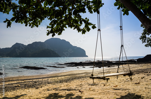 Swing hang from tree over beach, Island Koh Phi Phi Don, Krabi, South Thailand.