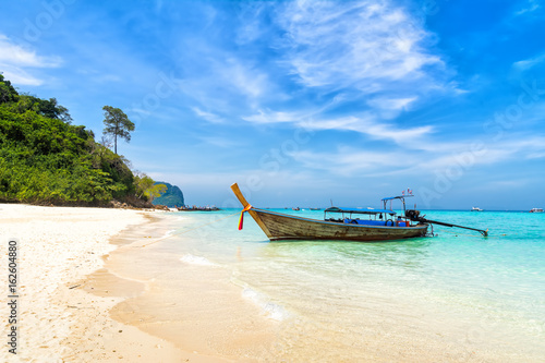 Fototapeta Naklejka Na Ścianę i Meble -  Amazing view of beautiful beach with traditional thailand longtale boat. Location: Bamboo island, Krabi province, Thailand, Andaman Sea. Artistic picture. Beauty world.