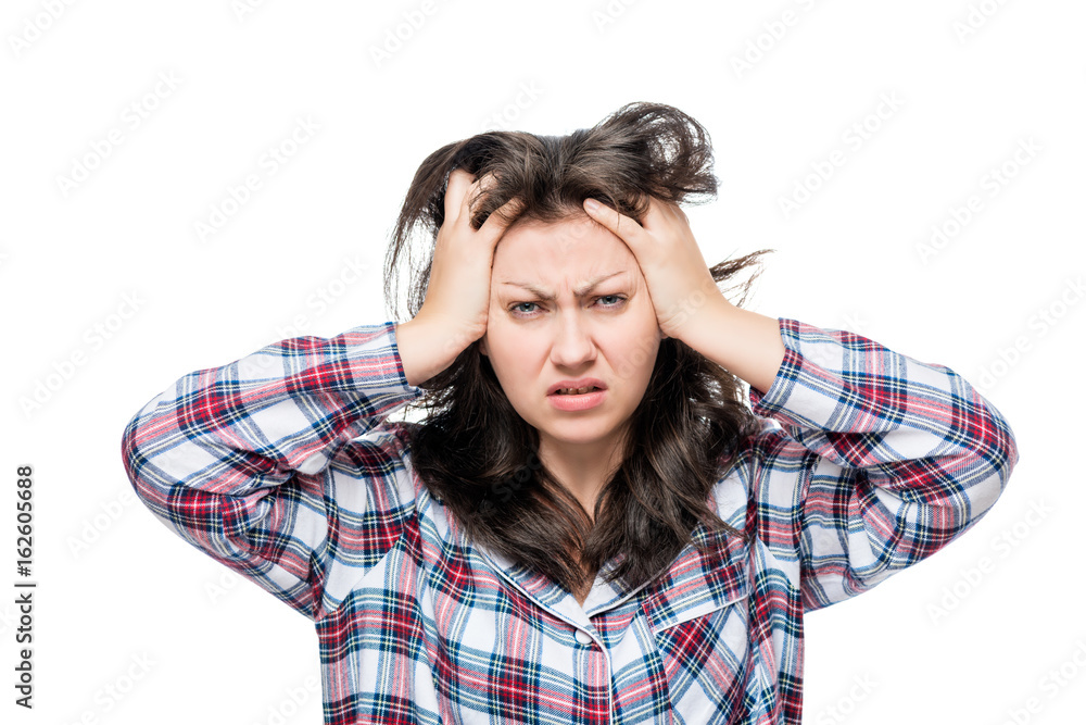 discontented disheveled woman after waking up, portrait on a white background discontented disheveled woman after waking up, portrait on a white background