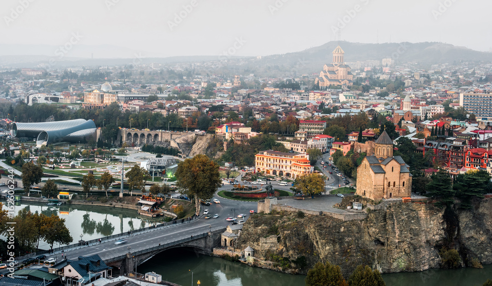 amazing Tbilisi cityscape with river and bridge, aerial photo
