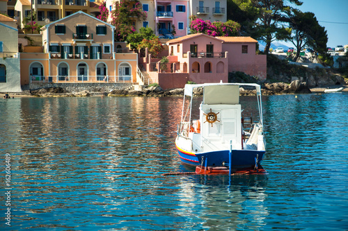 Boat in the bay in Assos village, Kefalonia island, Greece.