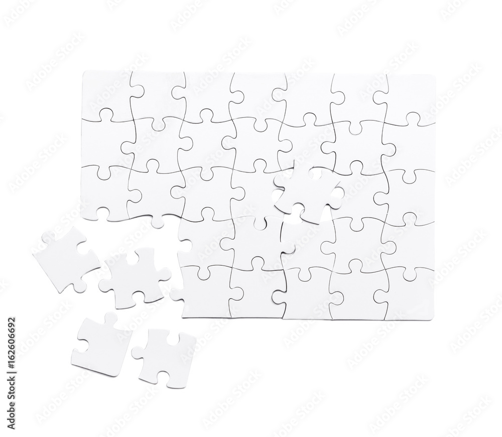 white unfinished puzzle isolated on a white background white unfinished puzzle isolated on a white background