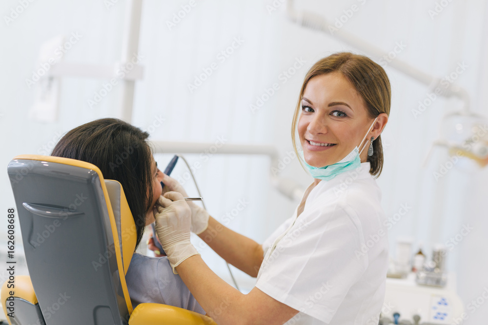 Work is a pleasure for her. Woman dentis at her office Work is a pleasure for her. Woman dentis at her office